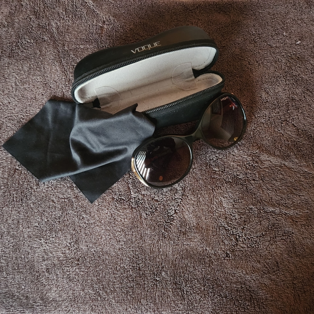 Vogue Sunglasses brown with gold trim accent temple and/or arm.